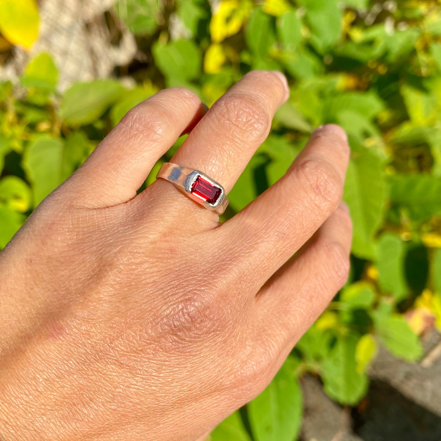 Garnet Pinky Ring features a rich red garnet stone set on a delicate band. Handmade by me in sterling silver, this ring is available in size M (US 6).