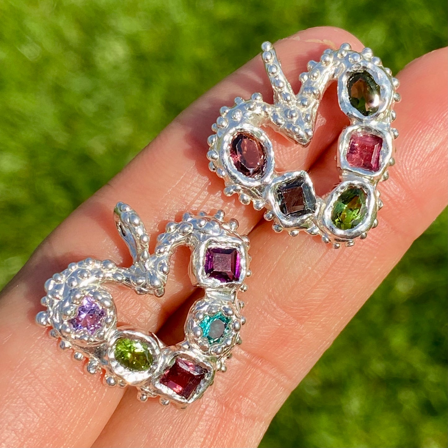 Dancing Heart Pendants are a collection of two unique, handmade pendants featuring vibrant tourmaline gemstones. Each pendant showcases five sparkling stones, playfully accented with tiny beads. Choose your favourite! They come with a delicate 42cm chain included.