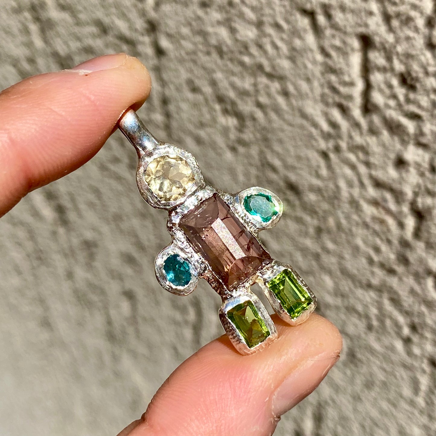 Fairy Light Pendant with green peridots, pink tourmaline, yellow citrine, and green synthetic stones. Handmade by Lia