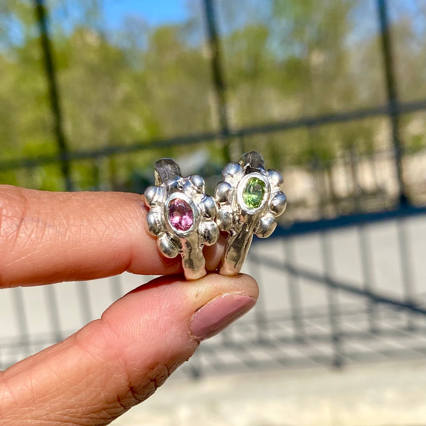 Fleur Ring — meaning flower in French — is a sterling silver ring featuring a vibrant tourmaline stone, available in green, pink, yellow, and light blue. This updated version of the Fleur Ring comes with a thicker band for a bolder look.
