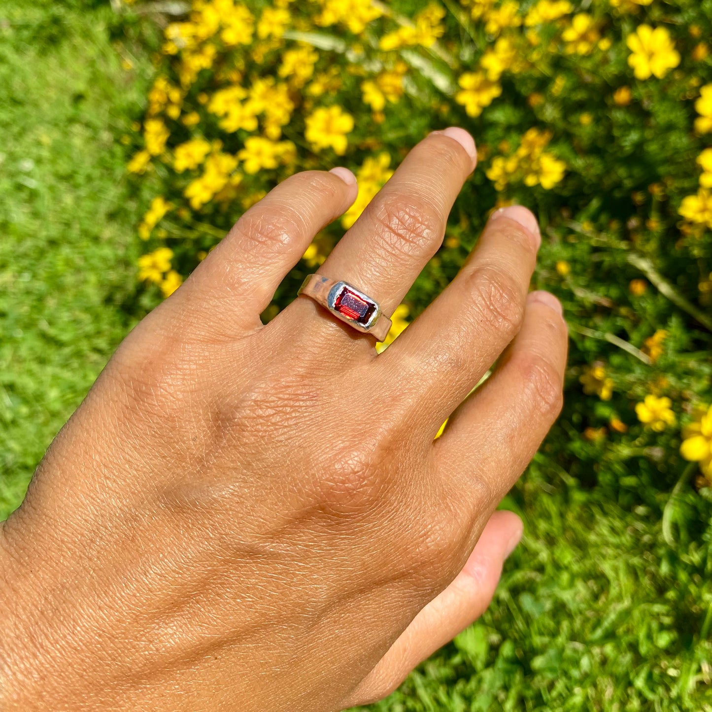Garnet Pinky Ring features a rich red garnet stone set on a delicate band. Handmade by me in sterling silver, this ring is available in size M (US 6).