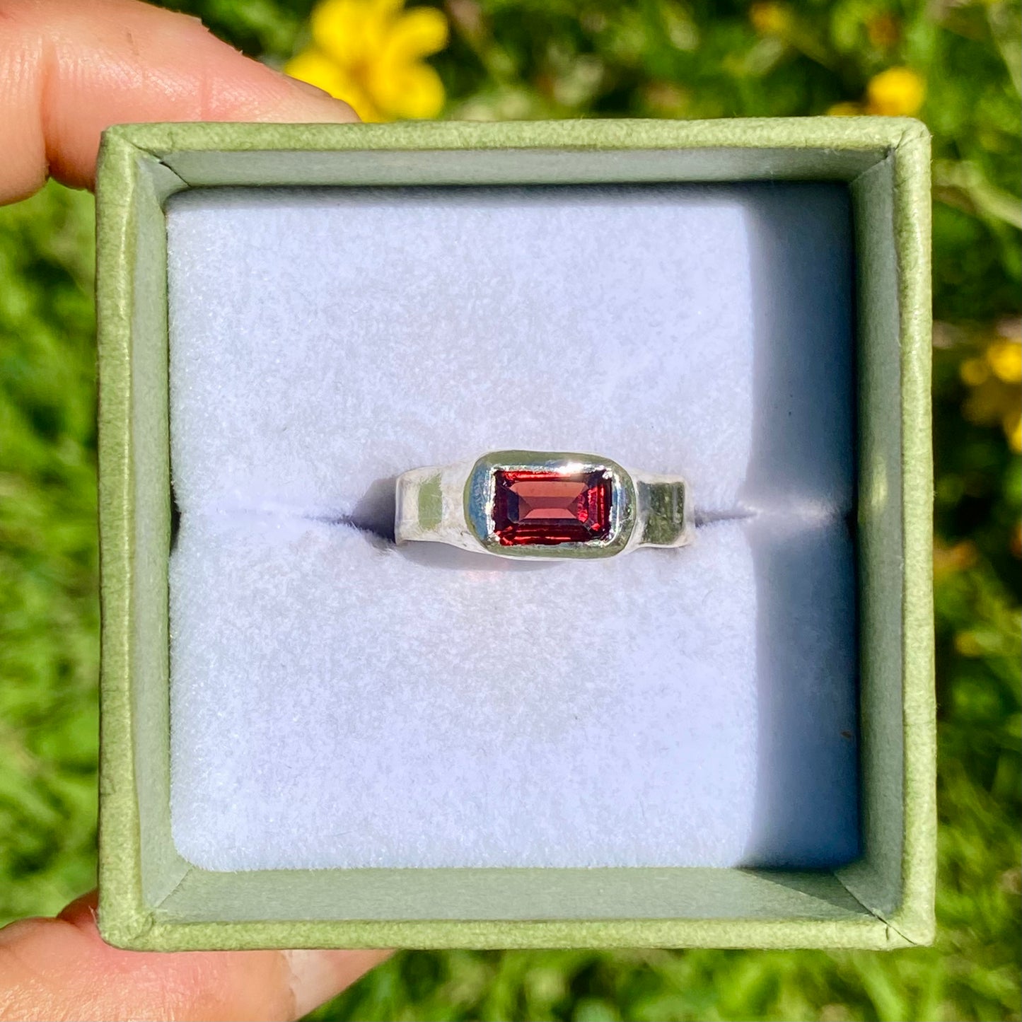 Garnet Pinky Ring features a rich red garnet stone set on a delicate band. Handmade by me in sterling silver, this ring is available in size M (US 6).