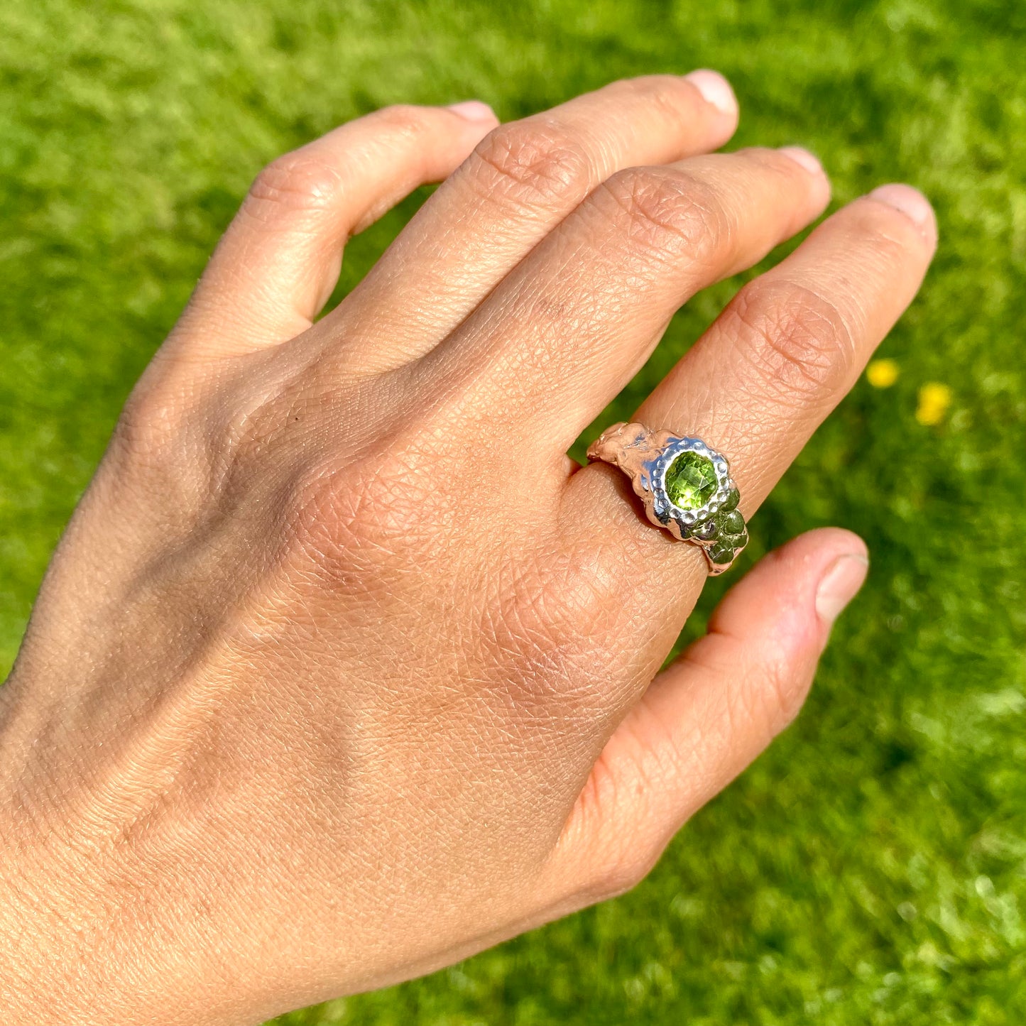Embrace springtime with the Hallo Green Ring! This chunky sterling silver ring features a vibrant green peridot stone. Available in size O (US 7) with resizing services. Shop unique, handmade jewellery by Lia Makes Jewellery!