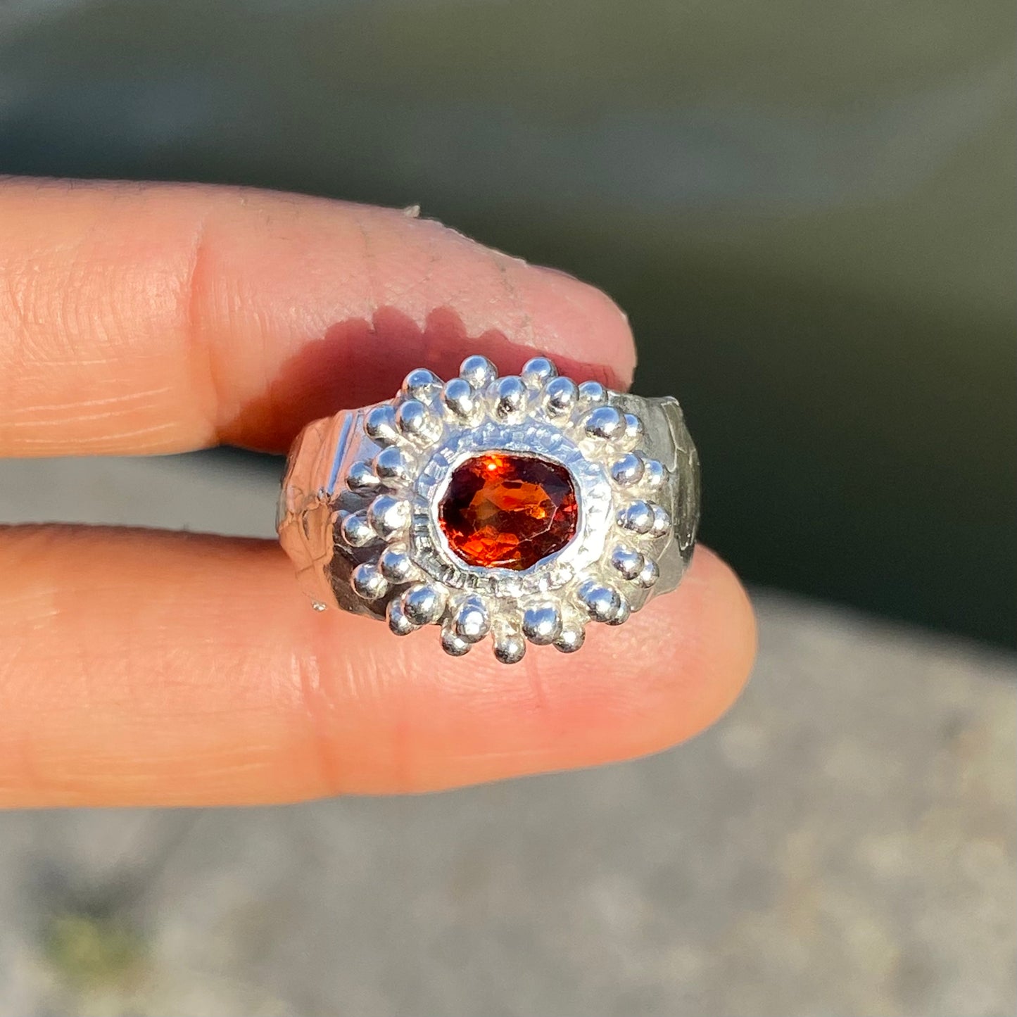 Orange Whisper Ring features an orange citrine in a wide chunky band. Handmade from sterling silver, this ring comes in a single size: M 1/2 or 6 1/4.