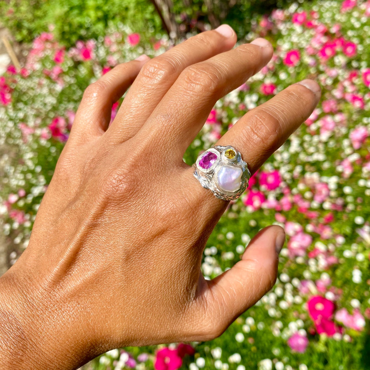 Spring Petals features a thick band with three stones: Keshi pearl, pink topaz, and yellow sapphire. The ring is available in size N 1/2 (US 6 3/4).