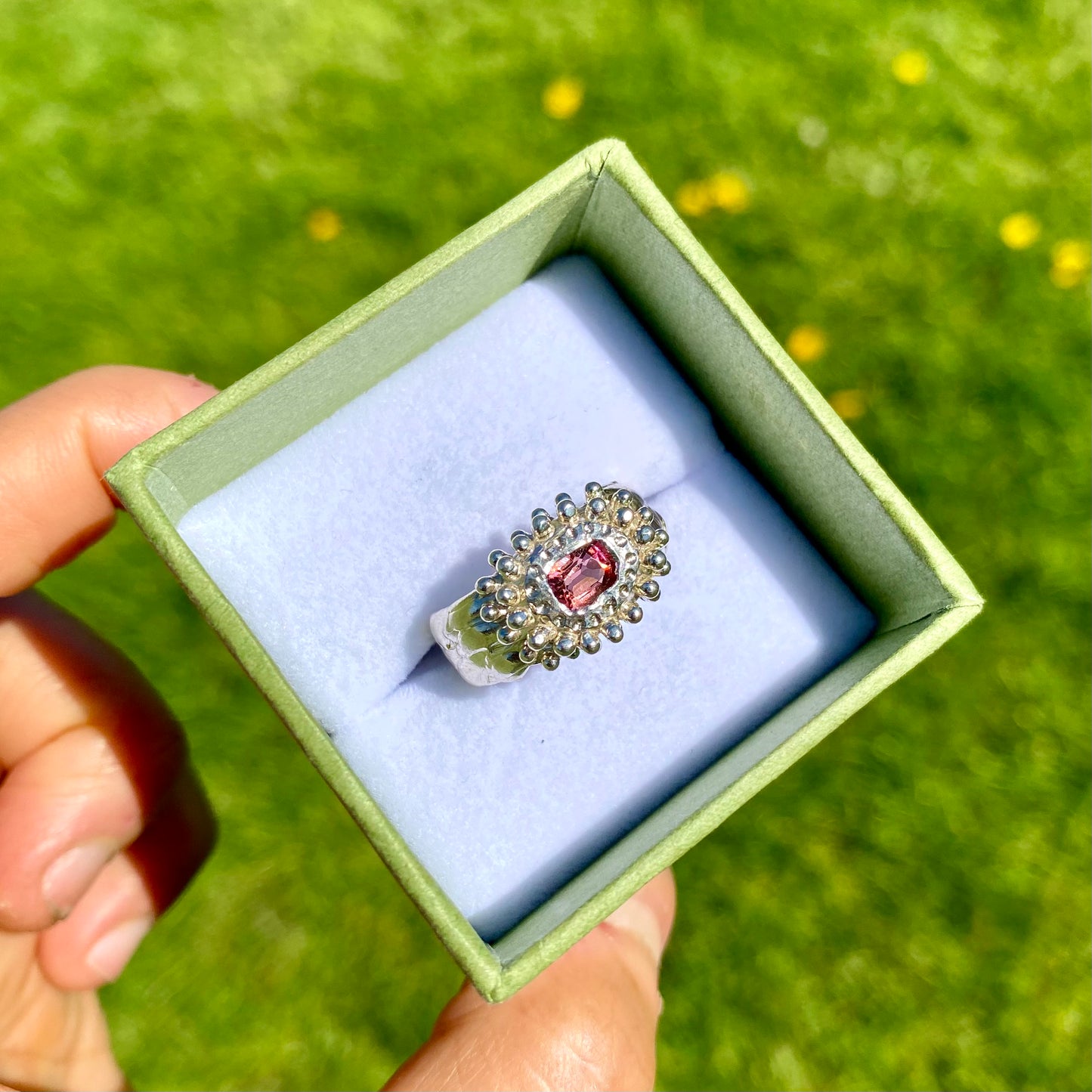 Embrace springtime with the Whisper Bloom Ring! This chunky sterling silver ring features a delicate pink spinel gemstone. Available in size US 6 ¼ (with resizing services).