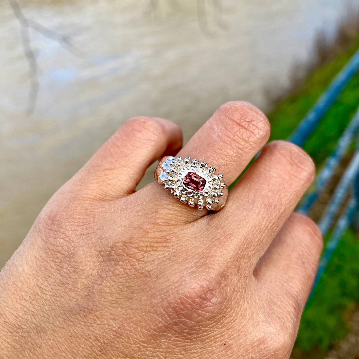Embrace springtime with the Whisper Bloom Ring! This chunky sterling silver ring features a delicate pink spinel gemstone. Available in size US 6 ¼ (with resizing services).