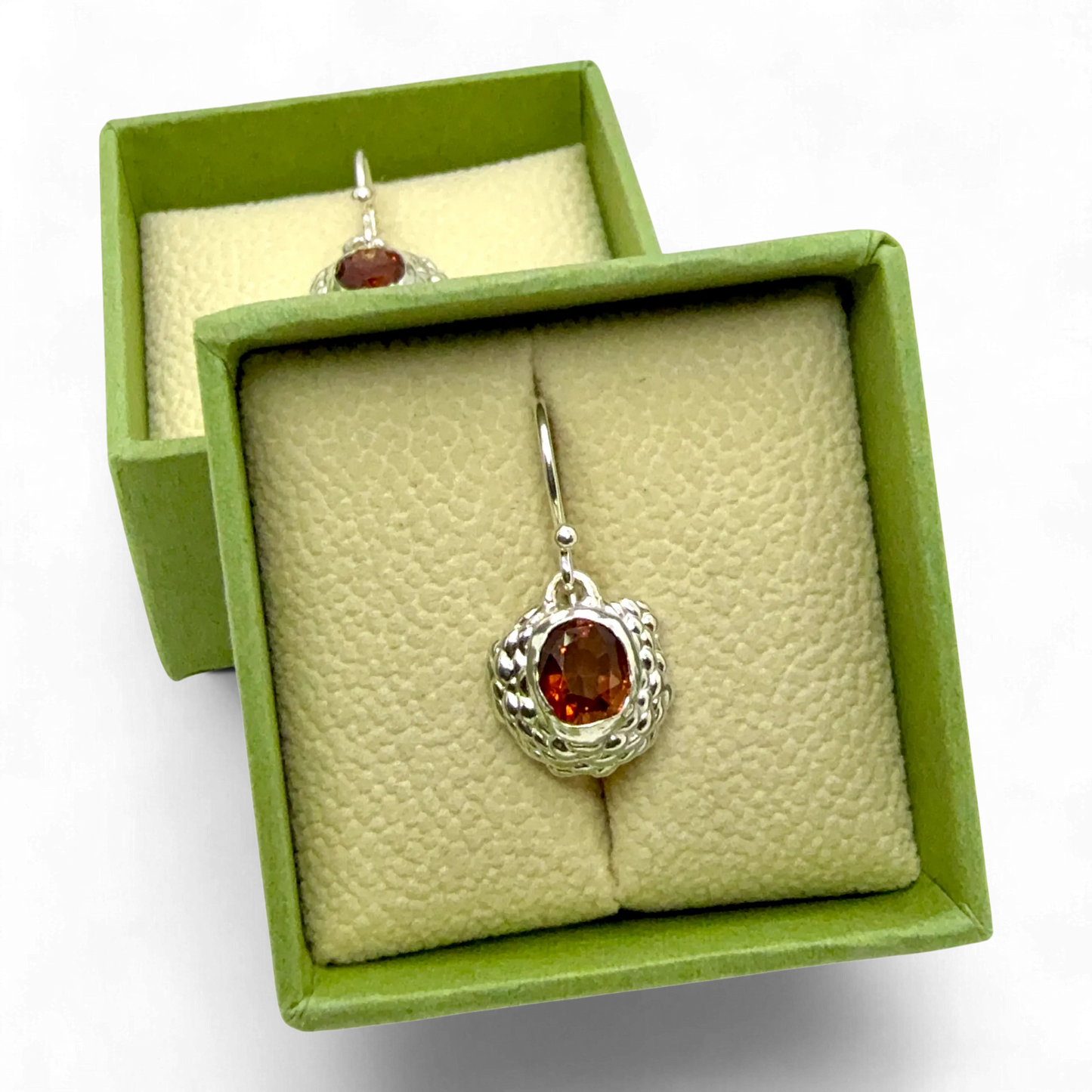 Pair of Sola Dangles on display — handmade sterling silver earrings featuring orange citrine gemstones by Lia Makes Jewellery.