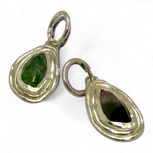 Side view of Orra Hoops showing sterling silver hoops with natural green-pink tourmaline stones.