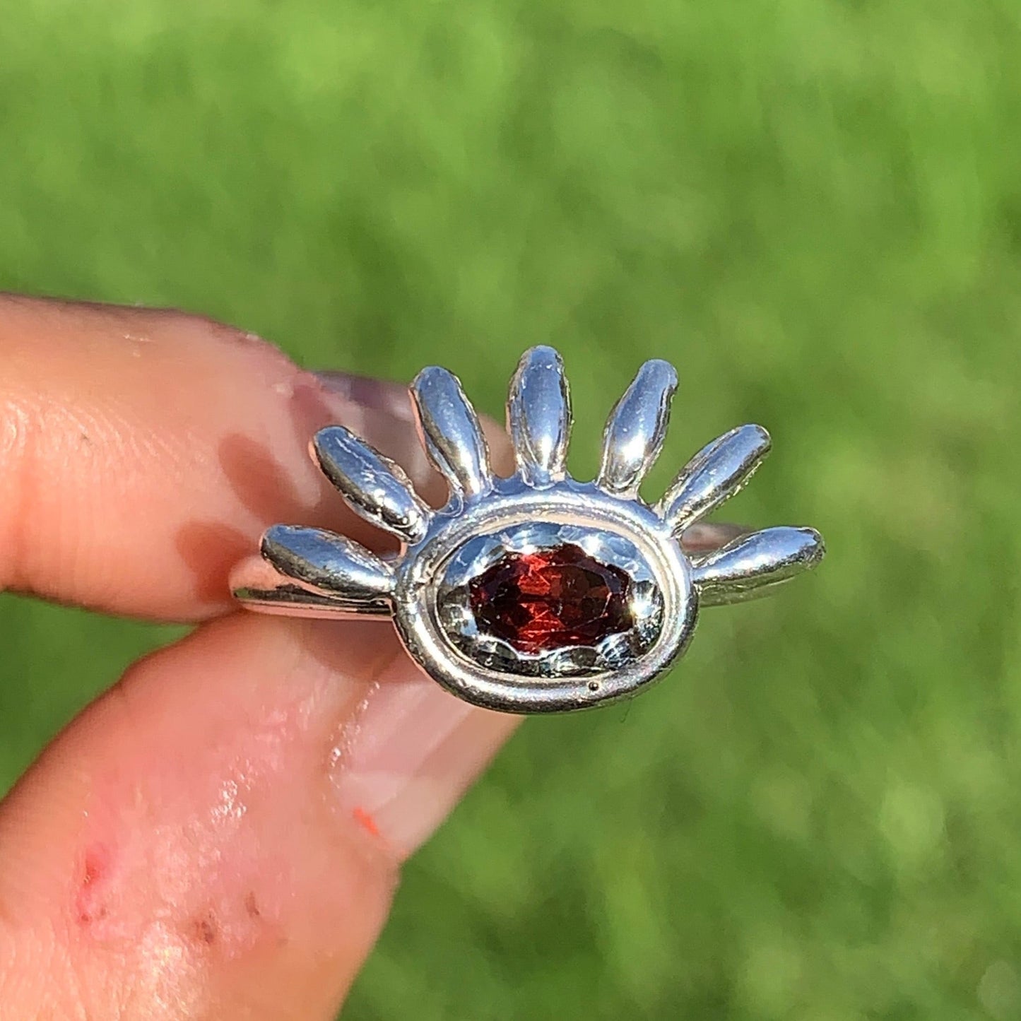 Eyelash ring comes with red garnet in sterling silver band.