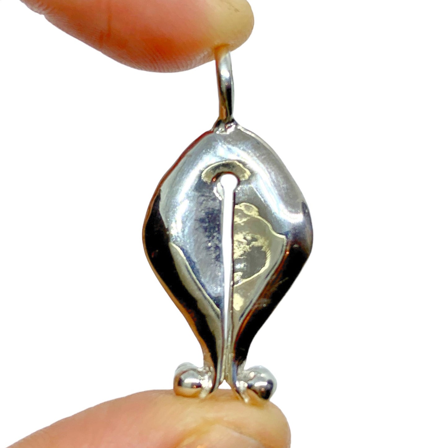 The Gadis pendant, which means "girl" in Bahasa Indonesia, is inspired by Mamuli, a traditional ornament from Sumba Island, Indonesia. In the past, Mamuli was worn by women as a symbol of beauty and status, and sometimes by men. It is designed to resemble female genitalia and is believed to symbolize prosperity, power, and the reproductive power of women. In Sumbanese mythology, Mamuli is also believed to have supernatural power and was used as a good luck charm and to communicate with ancestors.