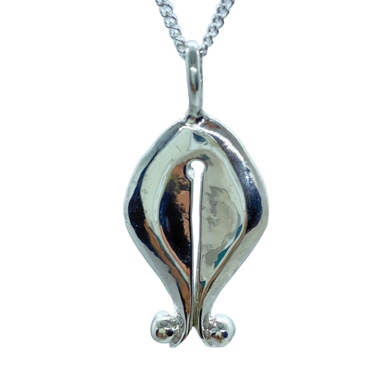 The Gadis pendant, which means "girl" in Bahasa Indonesia, is inspired by Mamuli, a traditional ornament from Sumba Island, Indonesia. In the past, Mamuli was worn by women as a symbol of beauty and status, and sometimes by men. It is designed to resemble female genitalia and is believed to symbolize prosperity, power, and the reproductive power of women. In Sumbanese mythology, Mamuli is also believed to have supernatural power and was used as a good luck charm and to communicate with ancestors.