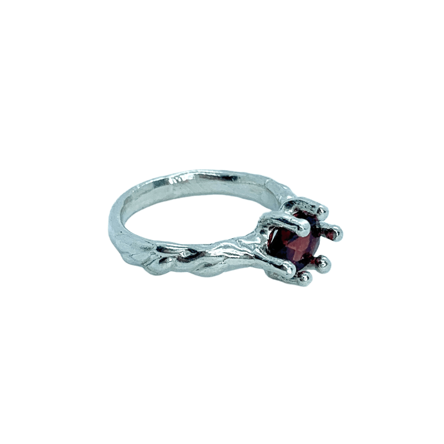 Sterling silver Gelora Ring with red garnet, size M 1/2 (US 6 1/4) with white background. Handmade by Lia in Paris.