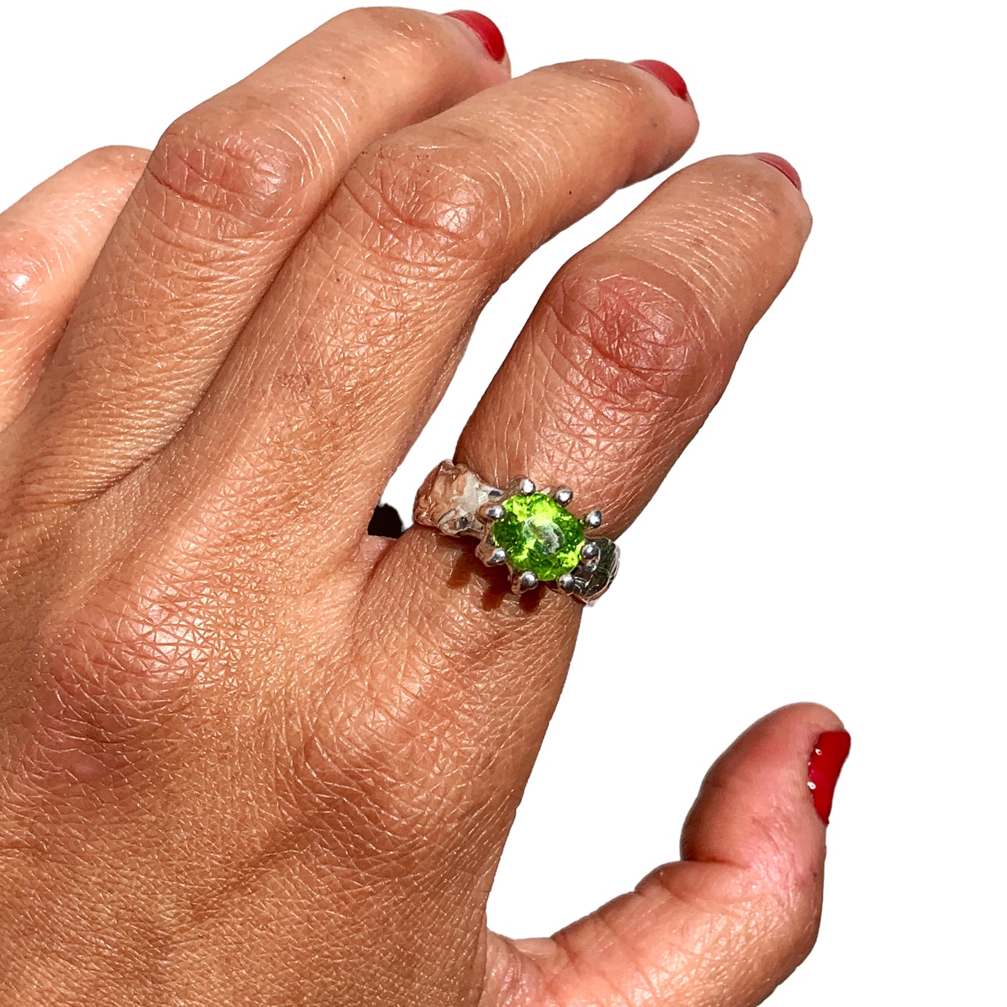 Jungle Queen ring is handmade from sterling silver and features a beautiful green peridot stone securely held in place by silver claws to showcase its captivating colour. It is available in size K 1/2.