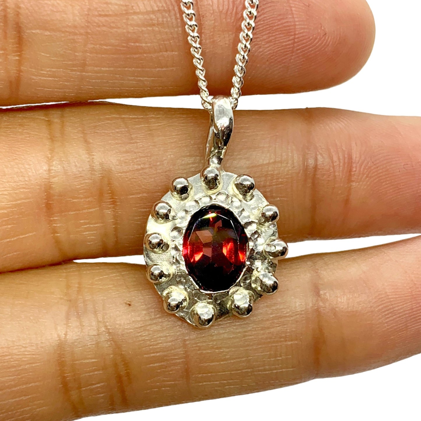 The Merah pendant, which is bahasa indonesia for red is made of sterling silver and features a red garnet stone. It comes with a 42cm silver chain.