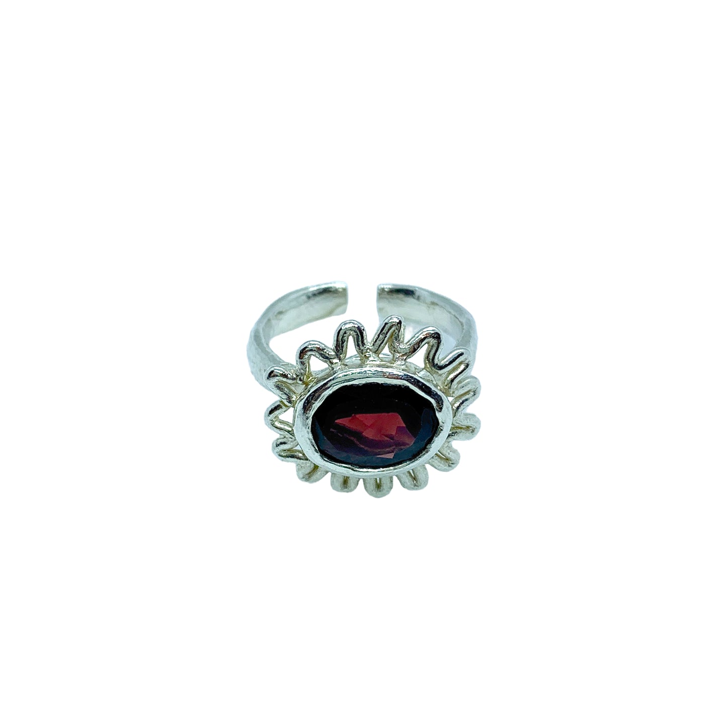 Sterling silver ring with red garnet and open-back design, fits sizes L–N. Shown the open back design. Handmade by Lia in Paris.
