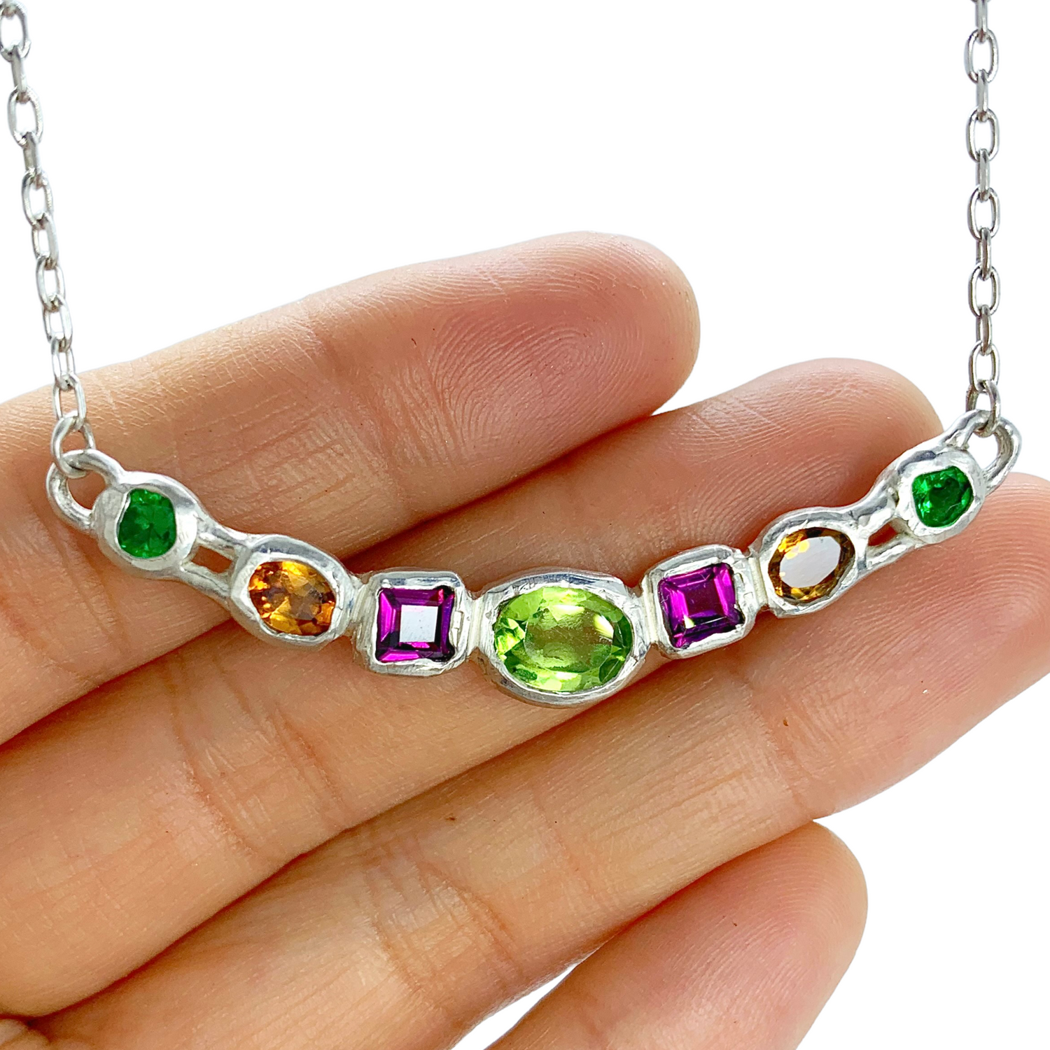 Warna-Warni Necklace comes with several colours. The main middle stone is Green Peridot. The rest of the stone are purple tourmalines, yellow tourmalines, and synthetic stones for the green. Warna-warni pendant is for everyday wear. 