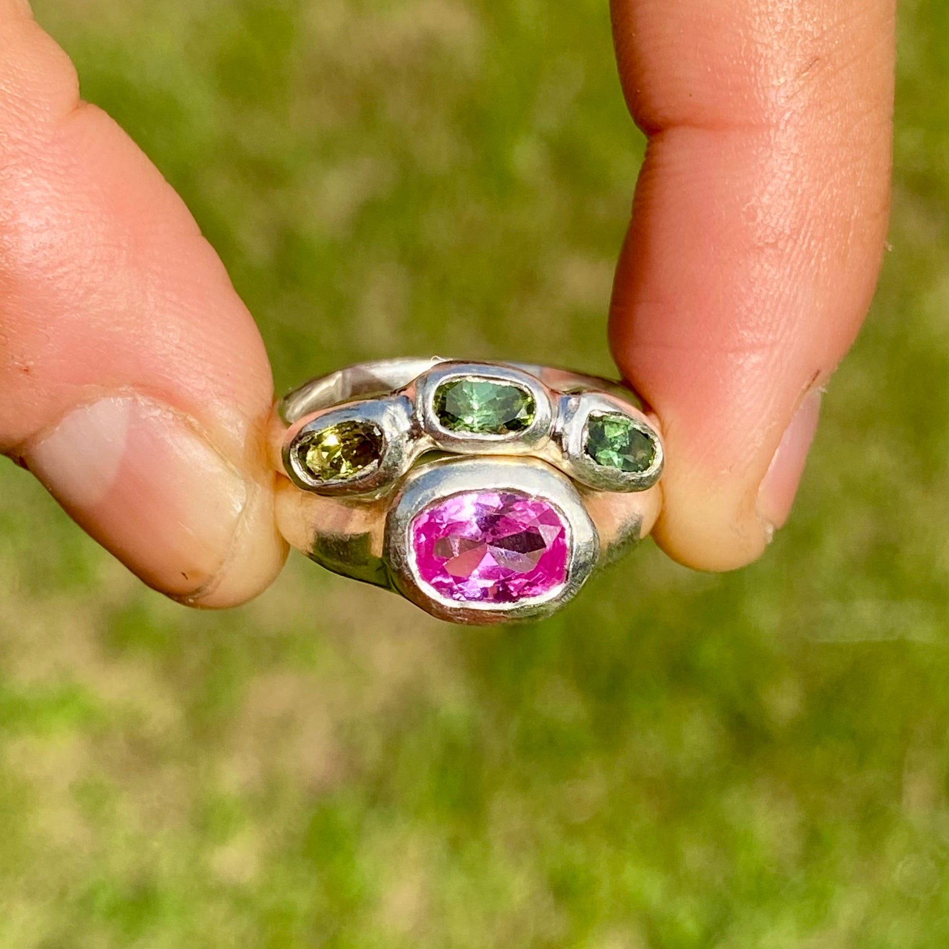 The Blush Oasis ring stack comes as a set of two. One ring features three green tourmaline stones, and the other has a pink topaz stone. Handmade by me from sterling silver, these stacking rings are available in one size: N (US 6 1/2)