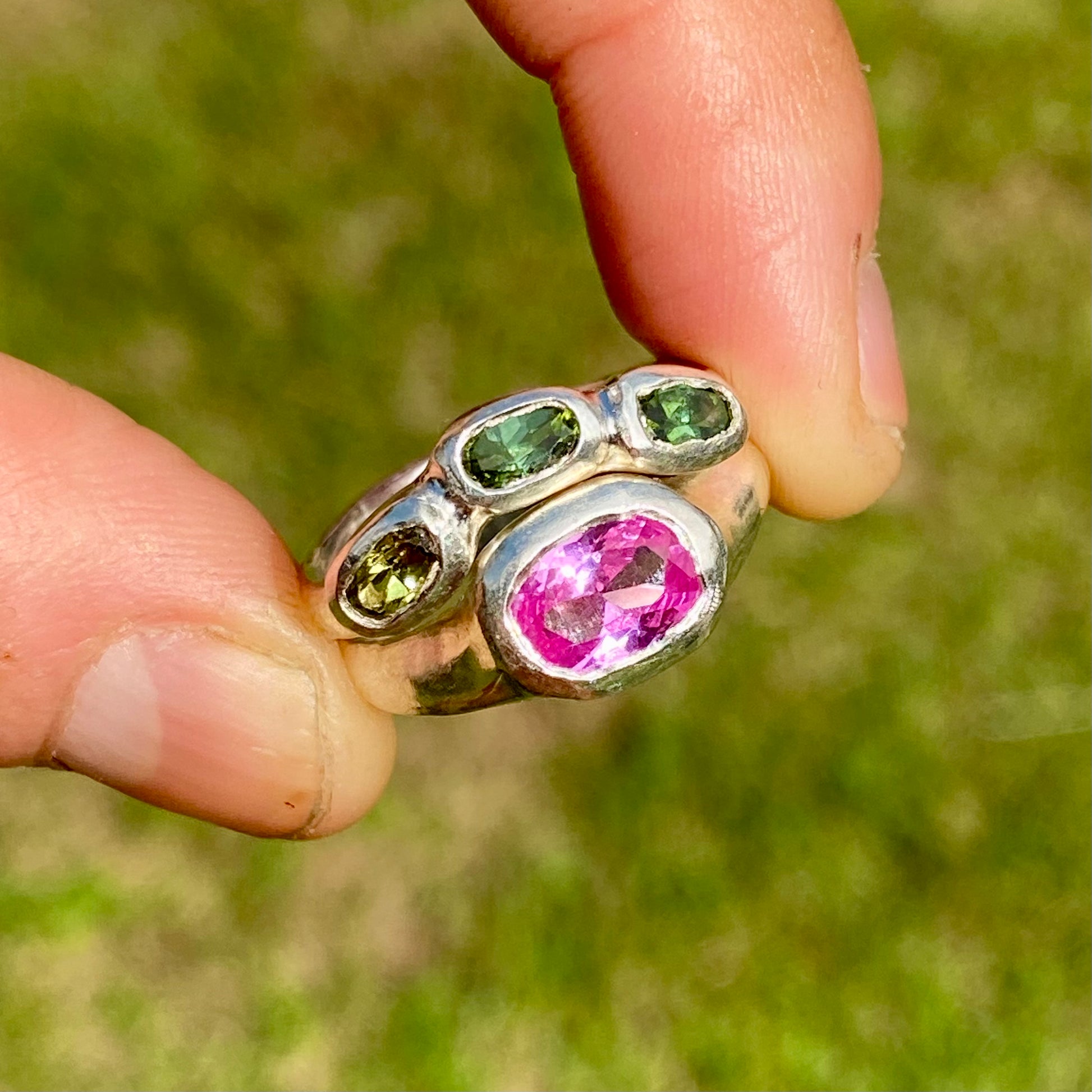 The Blush Oasis ring stack comes as a set of two. One ring features three green tourmaline stones, and the other has a pink topaz stone. Handmade by me from sterling silver, these stacking rings are available in one size: N (US 6 1/2)