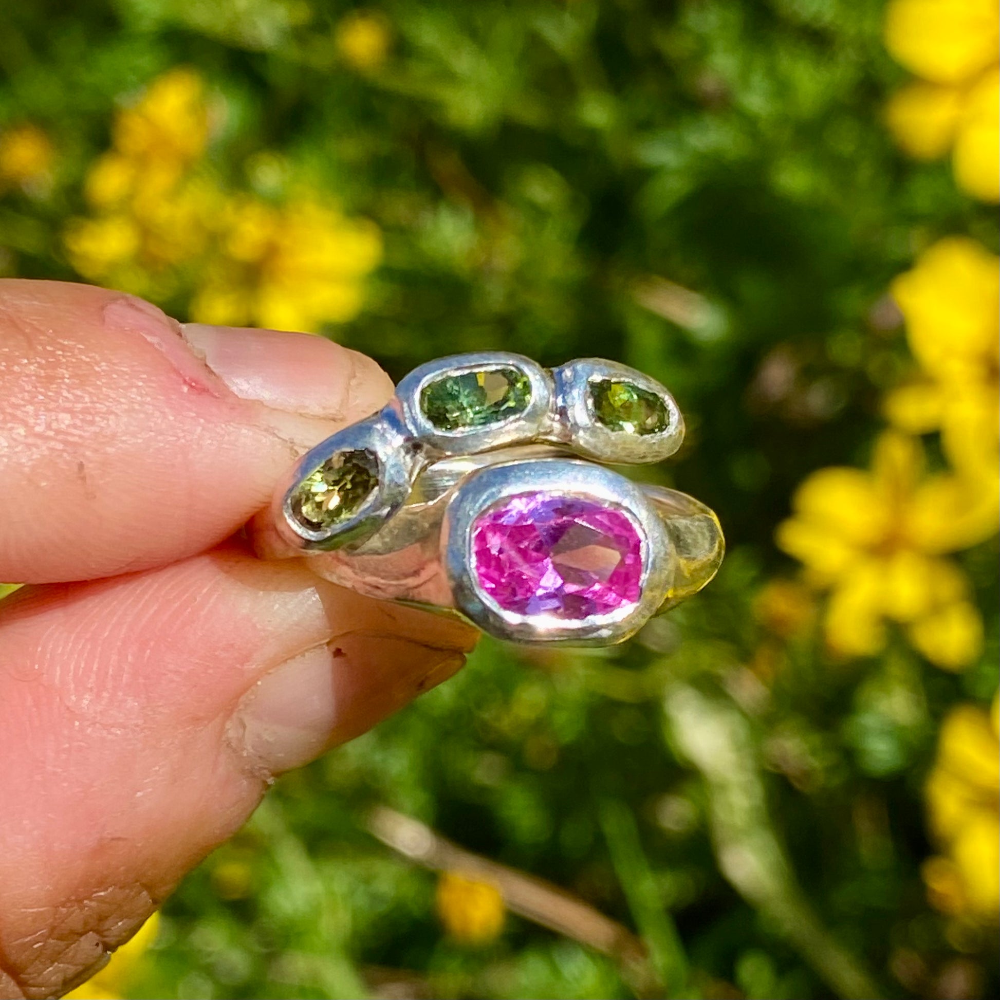 The Blush Oasis ring stack comes as a set of two. One ring features three green tourmaline stones, and the other has a pink topaz stone. Handmade by me from sterling silver, these stacking rings are available in one size: N (US 6 1/2)