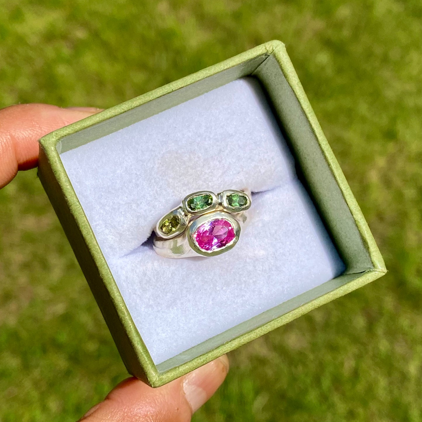 The Blush Oasis ring stack comes as a set of two. One ring features three green tourmaline stones, and the other has a pink topaz stone. Handmade by me from sterling silver, these stacking rings are available in one size: N (US 6 1/2)