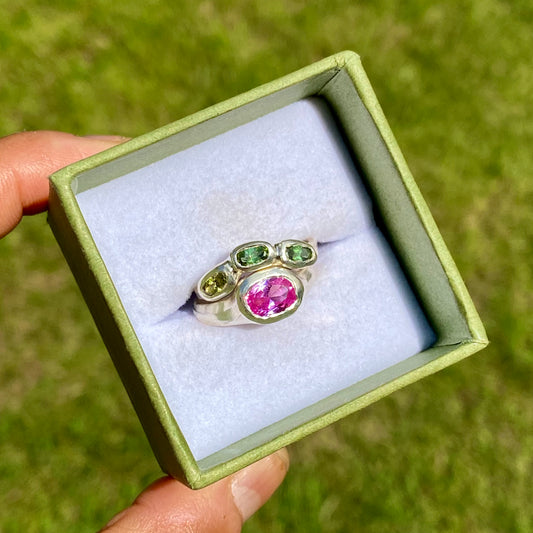 The Blush Oasis ring stack comes as a set of two. One ring features three green tourmaline stones, and the other has a pink topaz stone. Handmade by me from sterling silver, these stacking rings are available in one size: N (US 6 1/2)