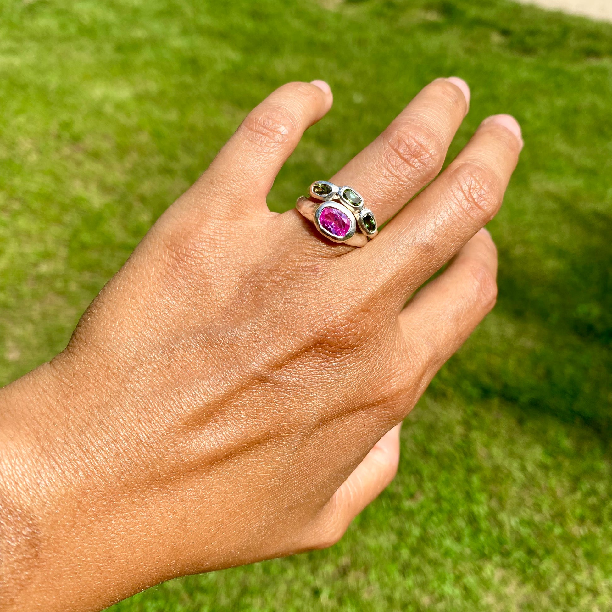 The Blush Oasis ring stack comes as a set of two. One ring features three green tourmaline stones, and the other has a pink topaz stone. Handmade by me from sterling silver, these stacking rings are available in one size: N (US 6 1/2)