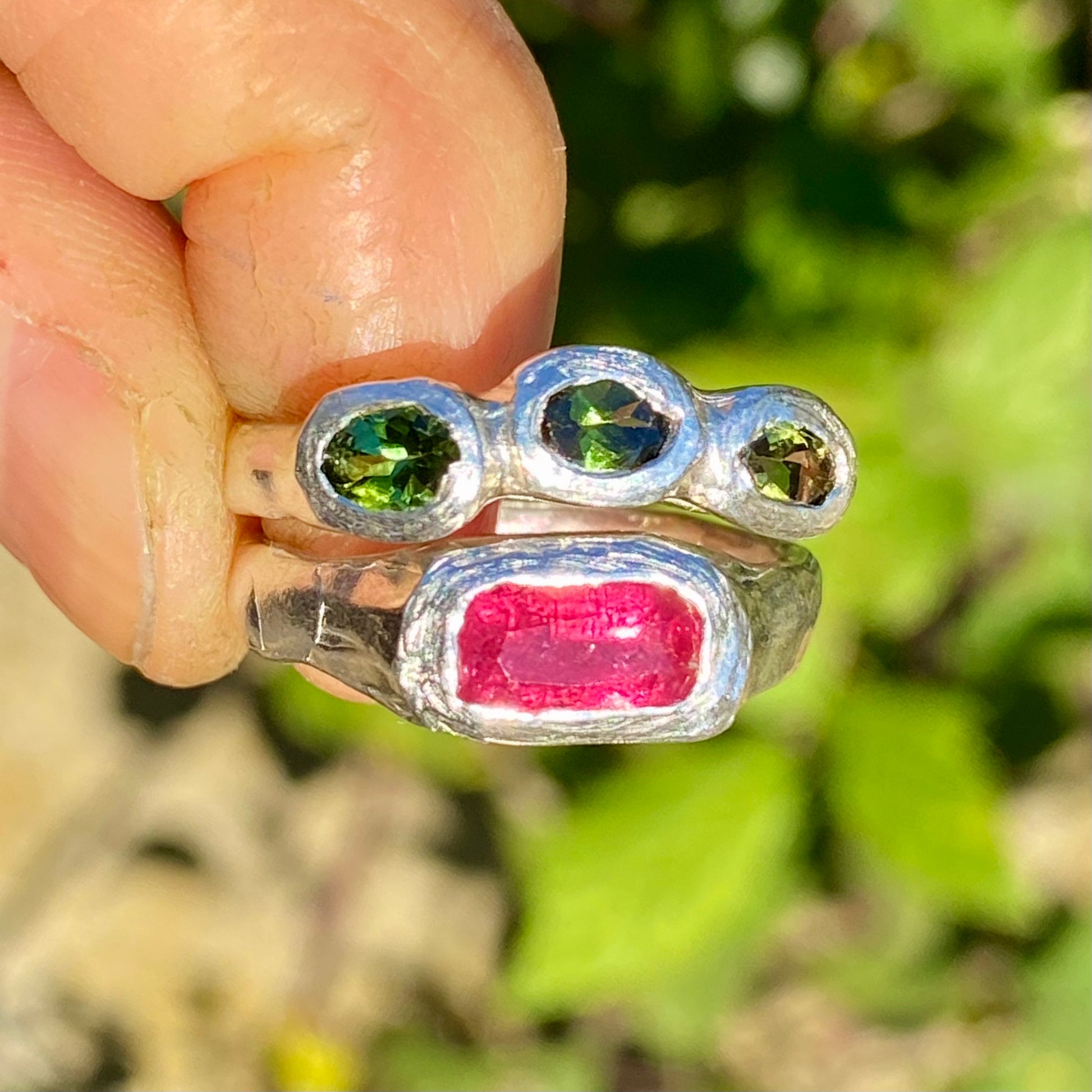 Handmade by Lia from Lia Makes Jewellery, this sterling silver ring stack features green and pink tourmalines. Sold as a set of two, available in size O 1/2 (US 7 1/4).
