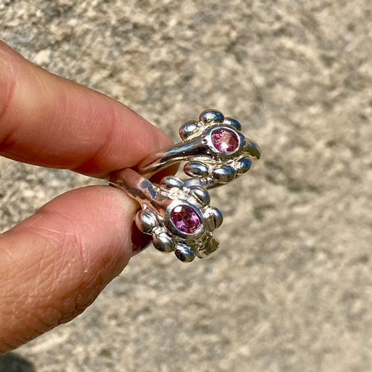 Sterling silver Fleur Ring with colourful tourmaline and bold band, against cream colour background. Handmade by Lia.