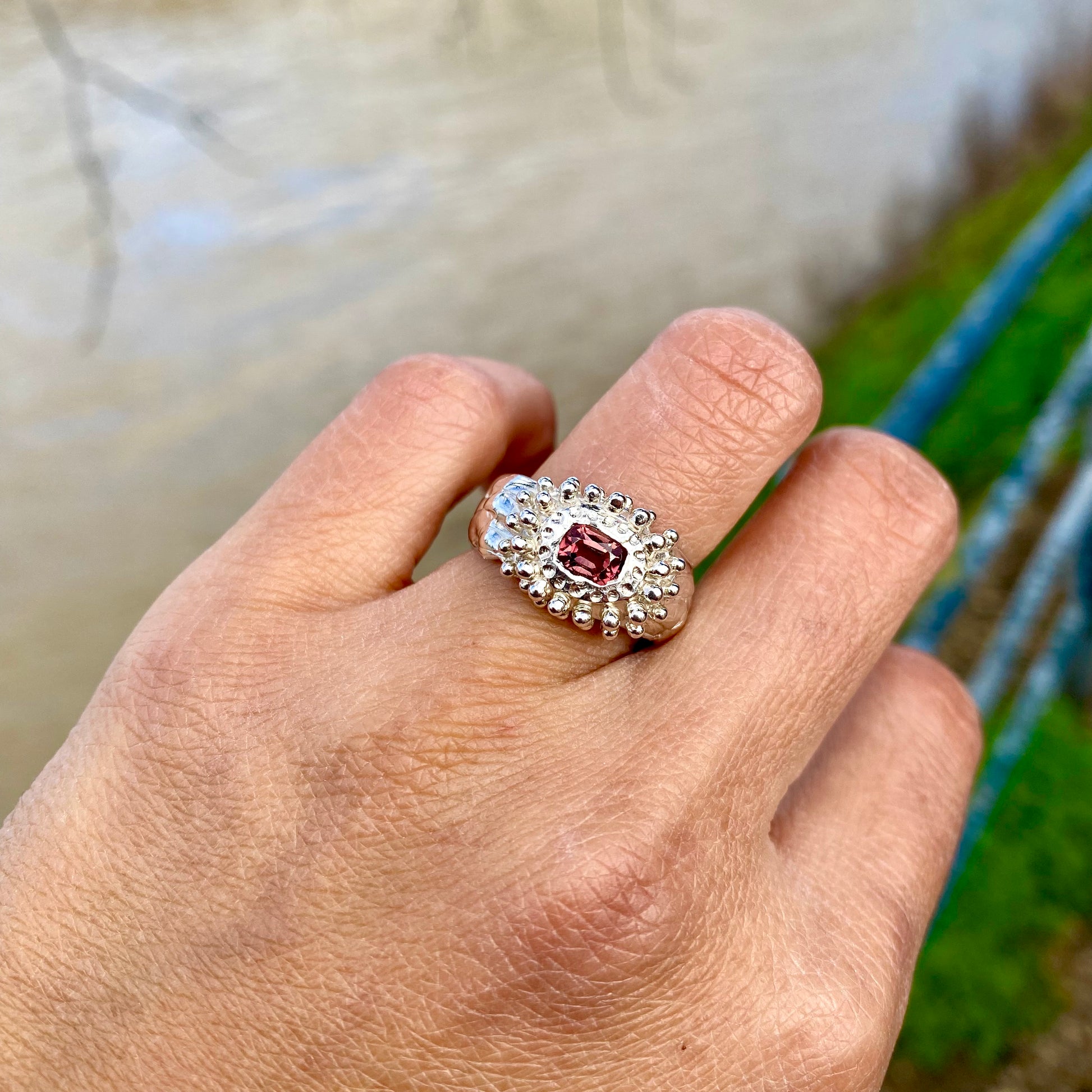 Embrace springtime with the Whisper Bloom Ring! This chunky sterling silver ring features a delicate pink spinel gemstone. Available in size US 6 ¼ (with resizing services). 