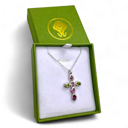 Harmony Pink Cross pendant presented in its jewellery box, showing sterling silver and vibrant tourmaline gemstones.