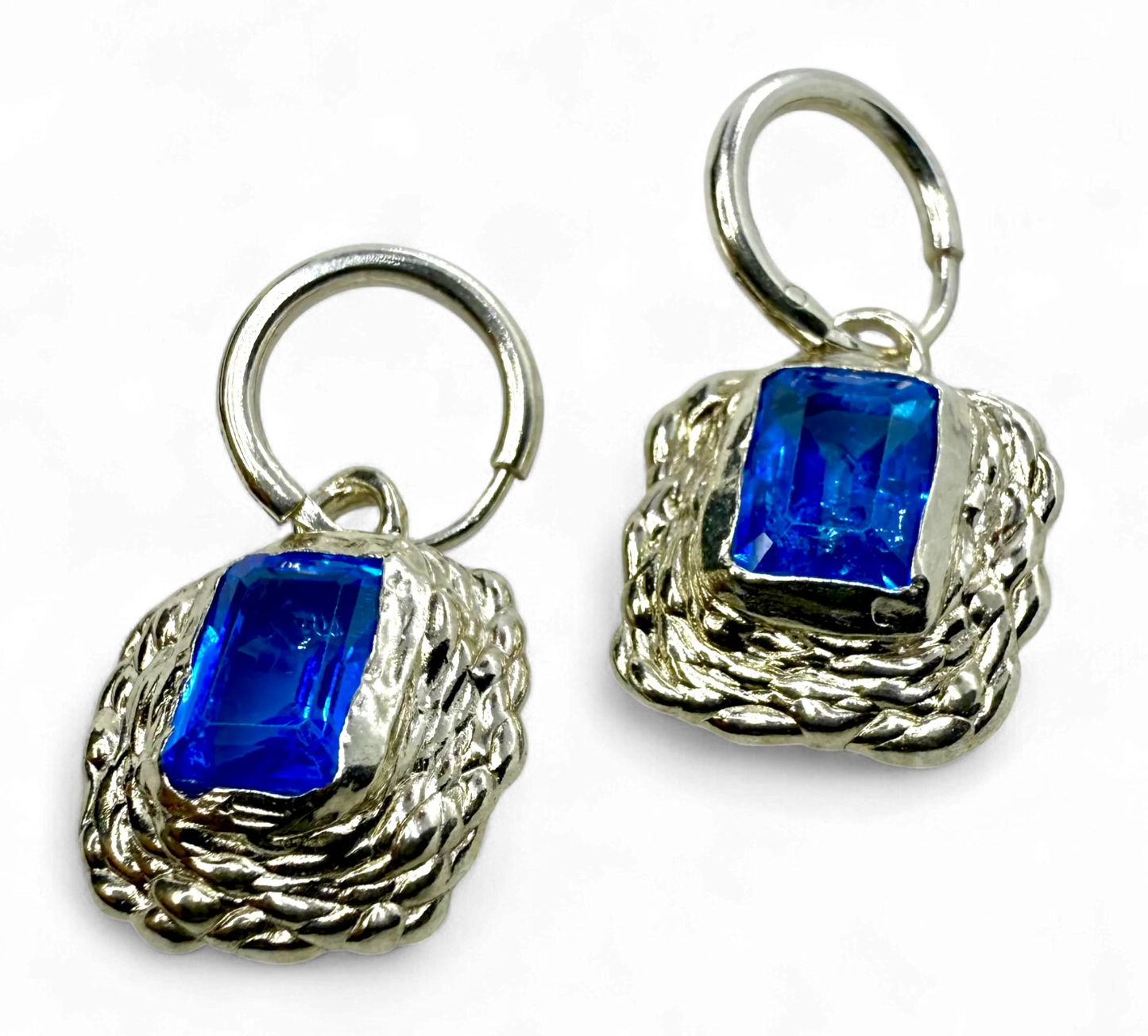 Astra Hoops handmade in Paris from sterling silver with blue topaz gemstones, crafted by Lia Makes Jewellery.