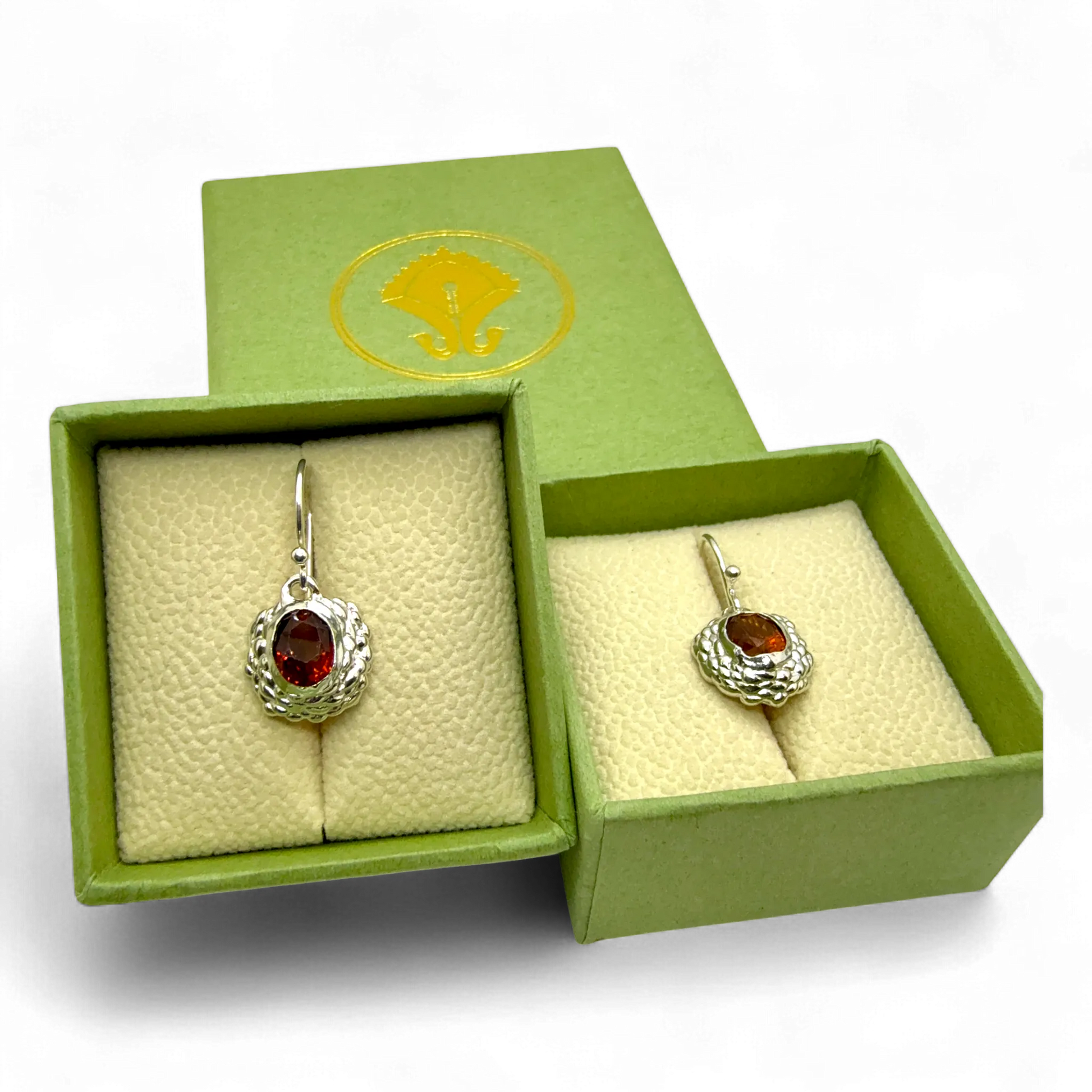 Sola Dangles presented on jewellery box — sterling silver dangle earrings with warm orange citrines.