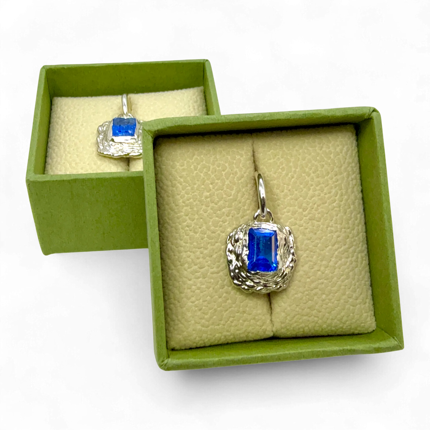 Astra Hoops presented on jewellery box — sterling silver hoop earrings with vivid blue topaz gemstones by Lia Makes Jewellery.