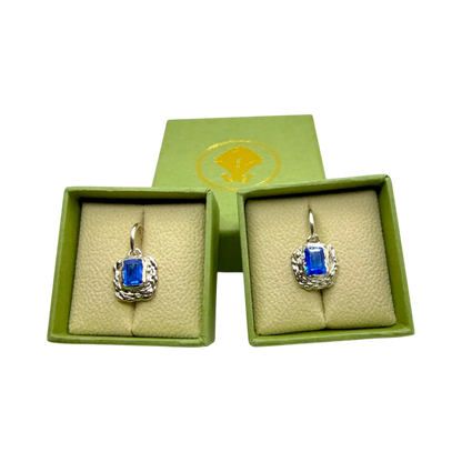 Astra Hoops presented on jewellery box — sterling silver hoop earrings with vivid blue topaz gemstones by Lia Makes Jewellery.