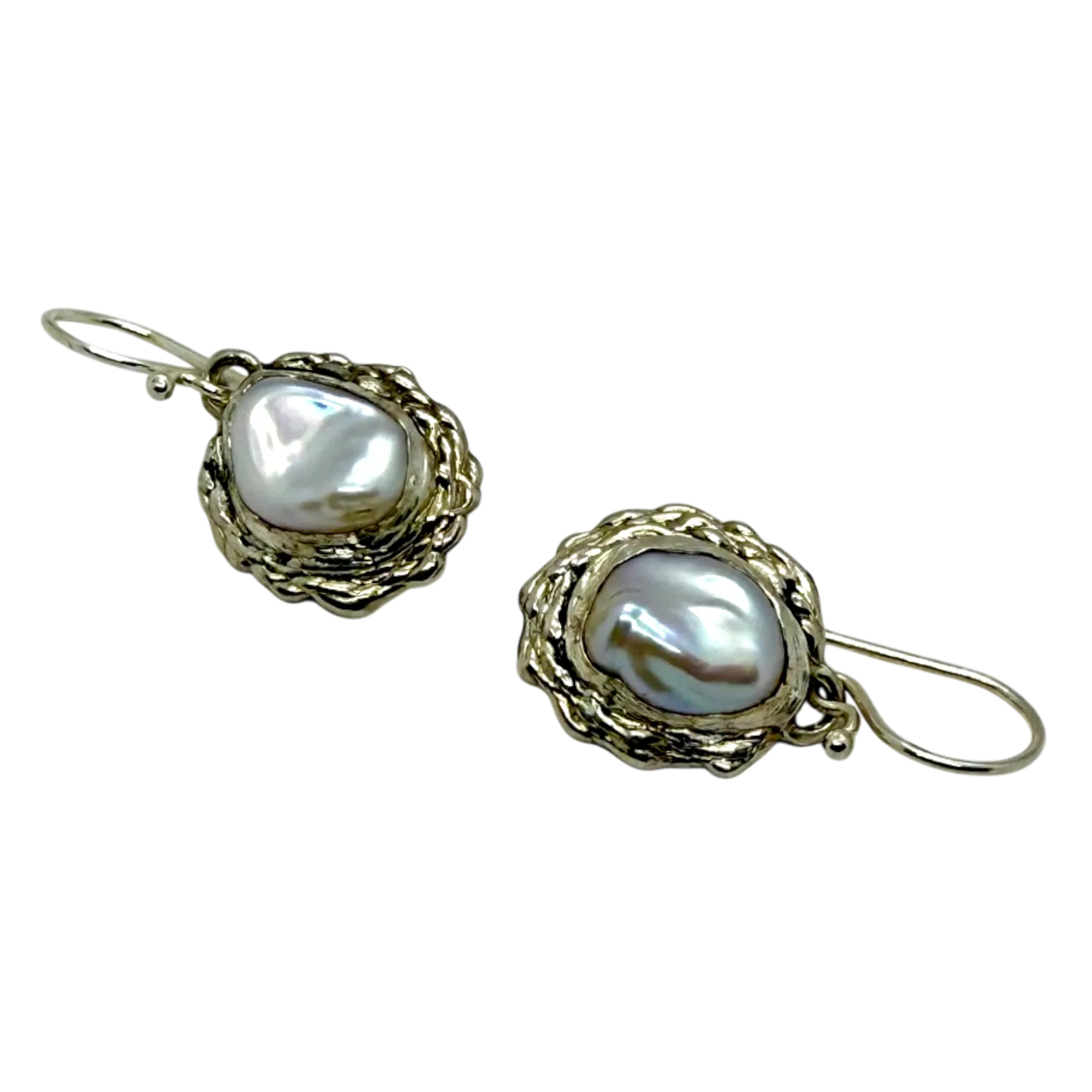 Side view of Bulan Dangles showing curved silver form and soft white pearl shine — handcrafted by Lia Makes Jewellery.