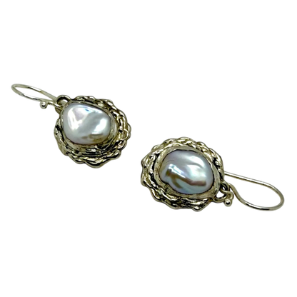 Side view of Bulan Dangles showing curved silver form and soft white pearl shine — handcrafted by Lia Makes Jewellery.