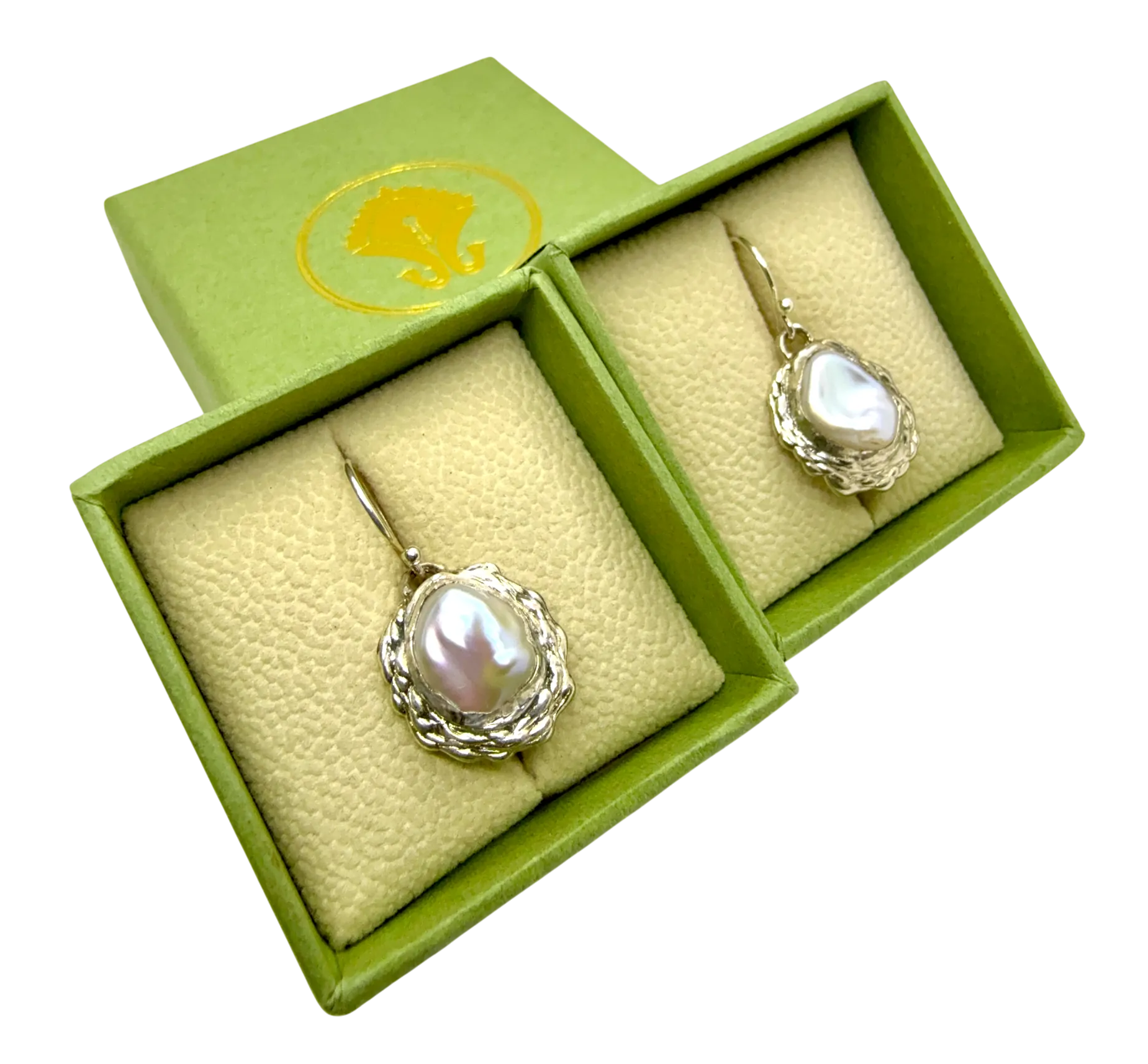 Bulan Dangles resting on Lia Makes Jewellery box — sterling silver and white pearl earrings handmade in Paris.