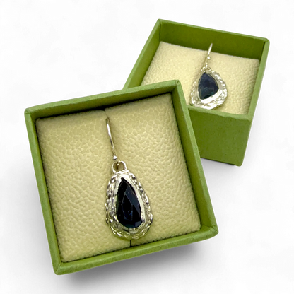 Close-up of Orra Dangles — sterling silver dangle earrings with green-bluish tourmalines, handmade in Paris.