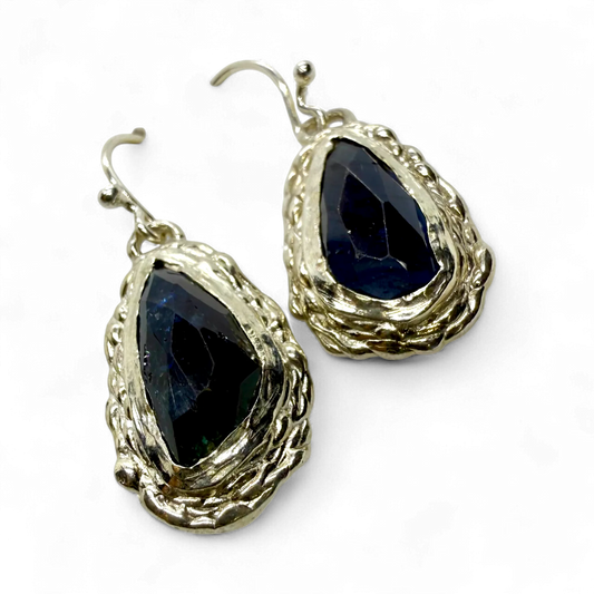 Side view of Orra Dangles showing the fine silver setting and natural green-bluish tourmaline gemstones.