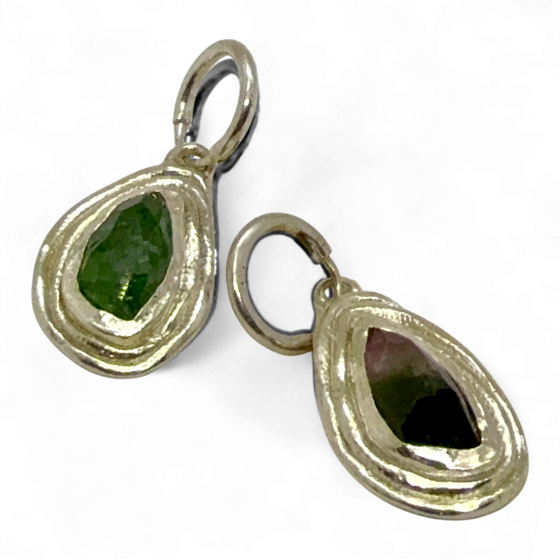 Side view of Orra Hoops showing sterling silver hoops with natural green-pink tourmaline stones.