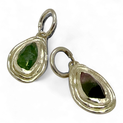 Side view of Orra Hoops showing sterling silver hoops with natural green-pink tourmaline stones.
