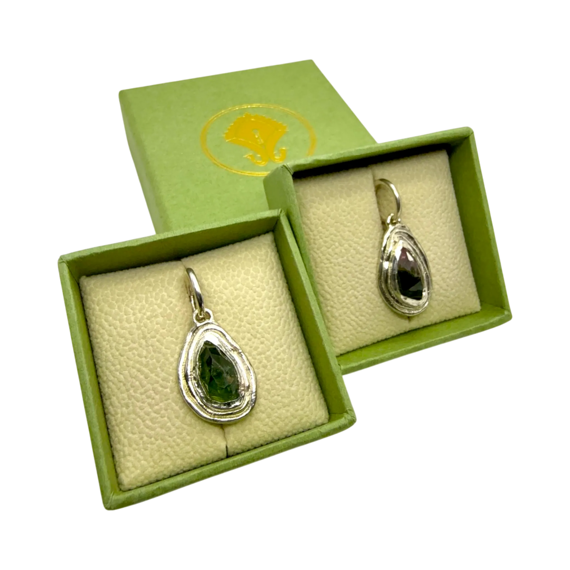 Orra Hoops presented in jewellery box — sterling silver hoops with green-pink tourmalines, handmade in Paris.