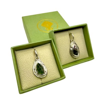 Orra Hoops presented in jewellery box — sterling silver hoops with green-pink tourmalines, handmade in Paris.