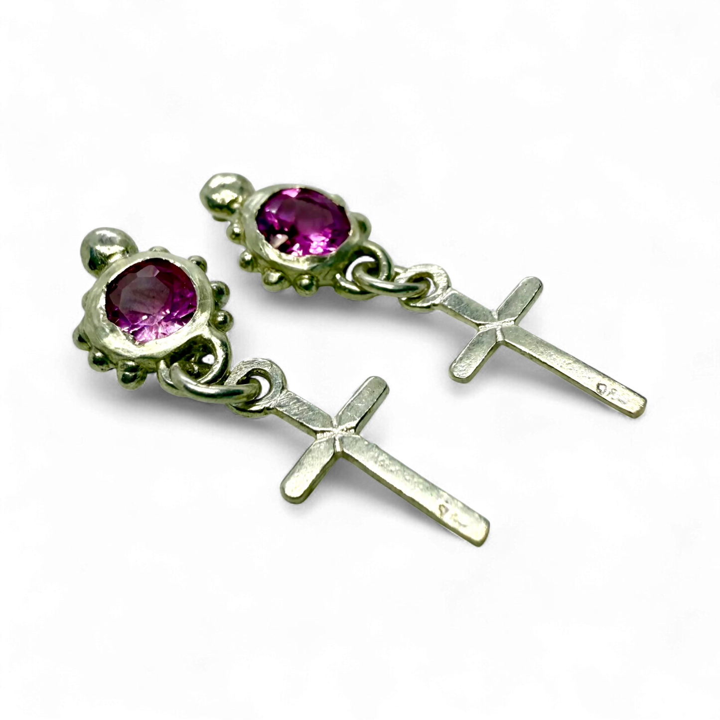 Side view of Rosae Studs showing sterling silver setting and soft pink topaz shine. 