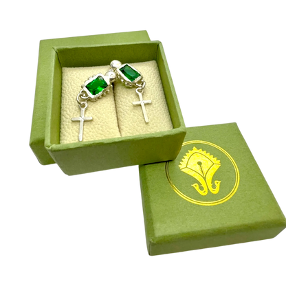 Close-up of Santo Studs highlighting fine silver texture and bright green stones.