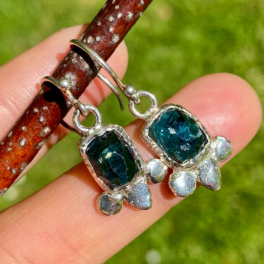Green Whisper Earrings Green Whisper Earrings feature green tourmalines with different green tones on each side of the earrings.