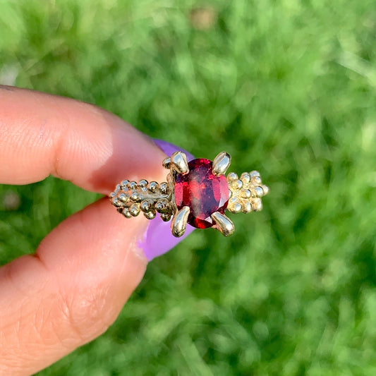 Claw Merah Ring comes with a red fire garnet in a claw with blobs cover half of the band. Its casted in 9ct yellow gold size M 1/2 or 6 1/4