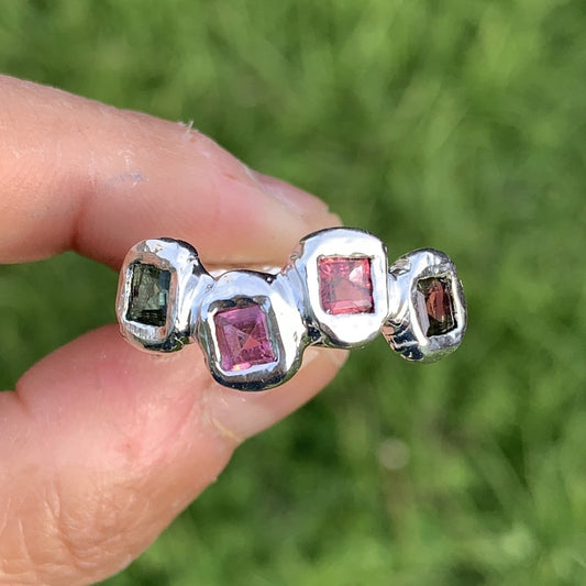 I made this ring when i was in a happy mood and i wished people who wore it would be happy every time they see the beautiful colour of the ring. The ring comes with four tourmalines stones in twirly band shape. The pink colour symbolise cool and the green colour is a symbol of romance. It is size L 1/2 or 5 7/8.