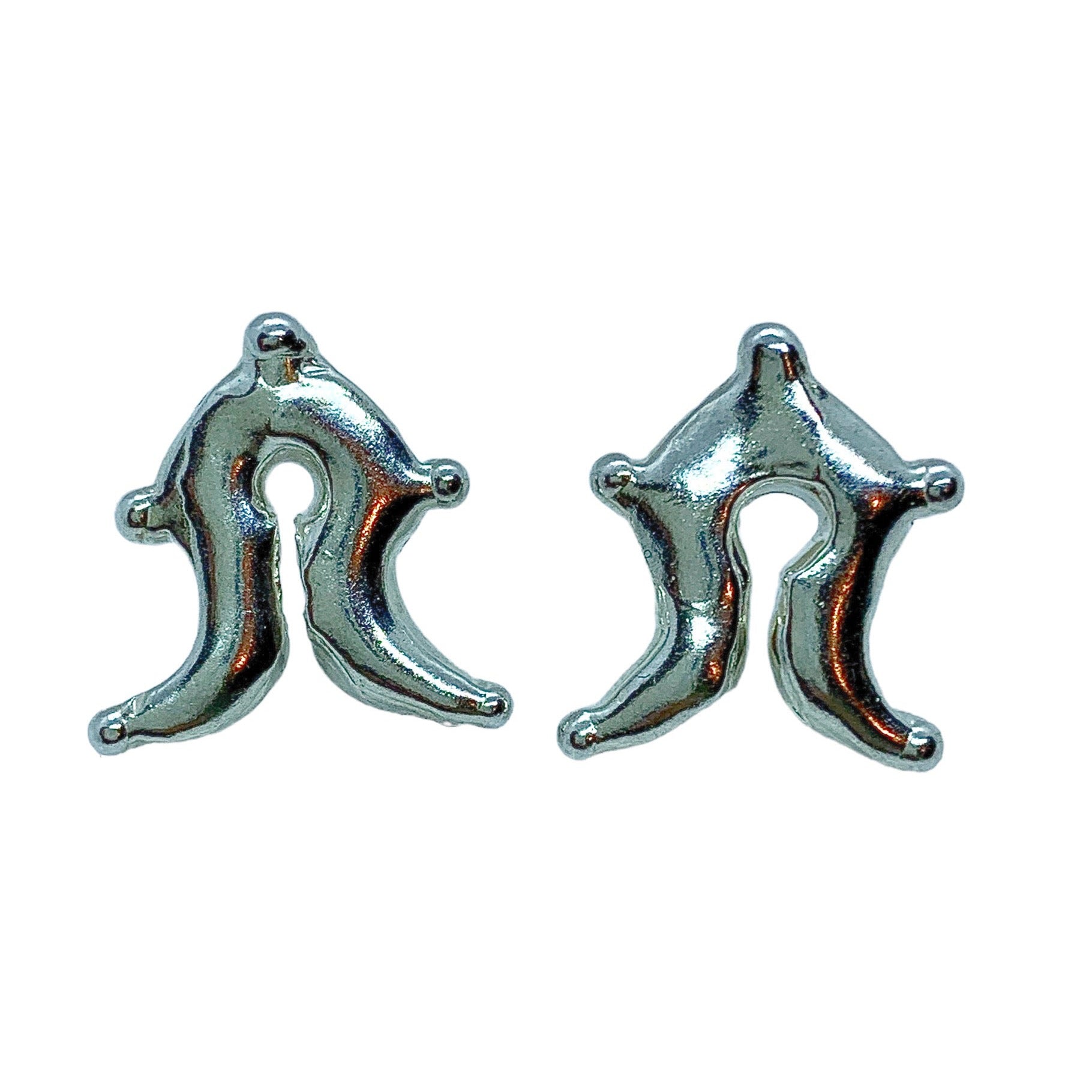 Mamuli are precious metal ornaments of the Sumba people, Sumba, Indonesia.The Mamuli ornaments have a shape which represents the female genitalia, symbolising the woman as the giver of life. The round hole and a slit in the middle is a symbol of woman's sexuality and reproductive power.  